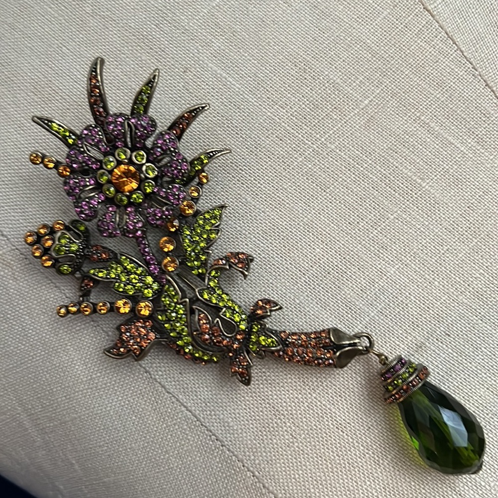 HEIDI DAUS purple & green flower pin with green stone drop.